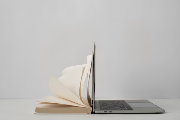 Laptop and open book assortment