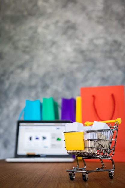 laptop and shopping bags, online shopping concept