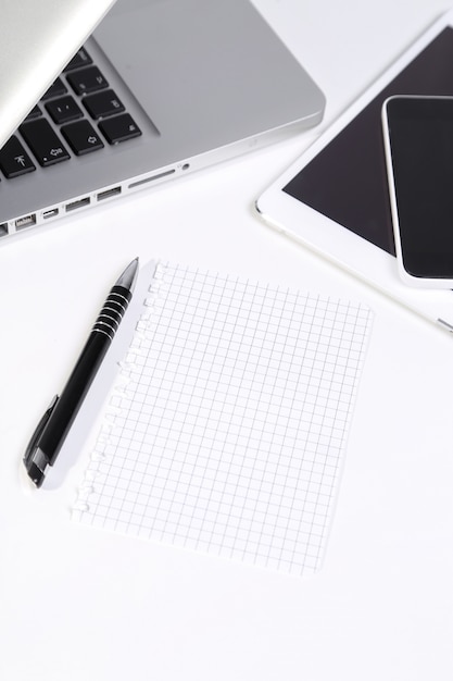 Laptop, smartphone, tablet and pen on the table