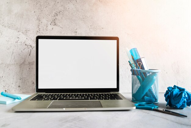 Laptop and stationery office tools on desk