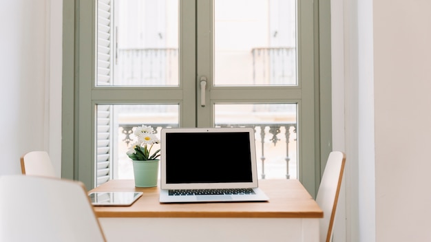 Laptop on table in stylish room