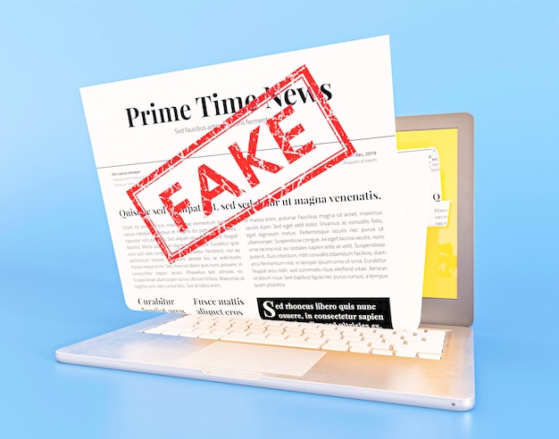 Free photo laptop with fake news webpage