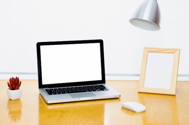 Laptop with frame on table 