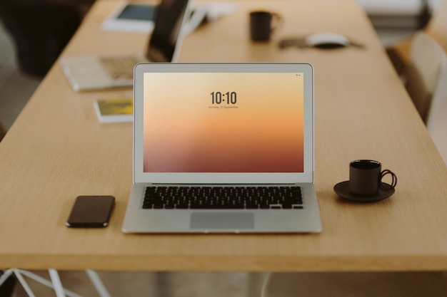 Free photo laptop on a wooden office table