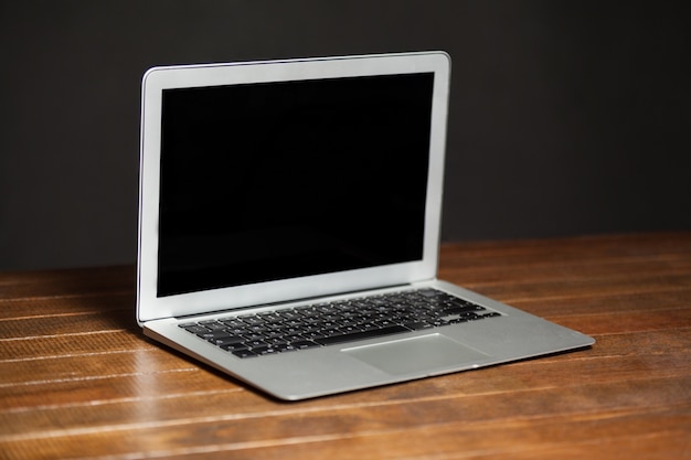 Laptop on wooden table