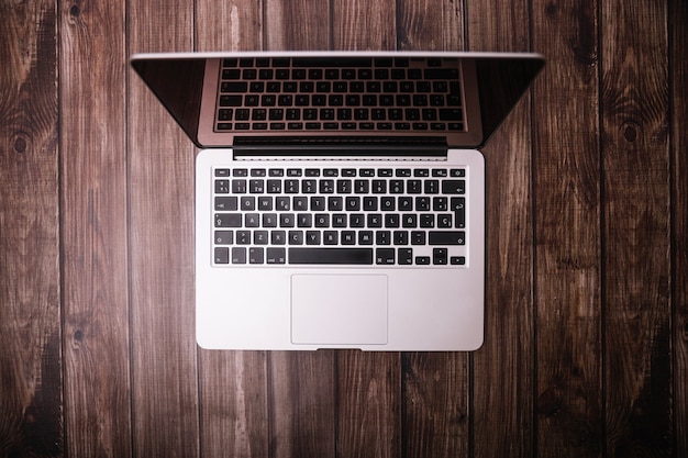 Laptop on wooden table