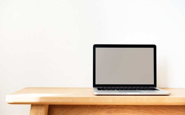 Laptop on a wooden table