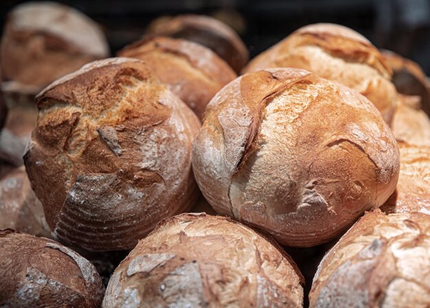 Large loaves of bread on the counter of a bakery