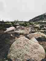 Free photo large rocks lie among the mountains