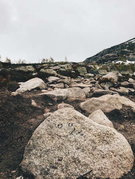 Large rocks lie among the mountains