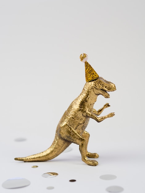 Lateral view golden toy t-rex
