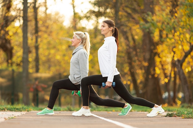 Lateral view women preparing for workout