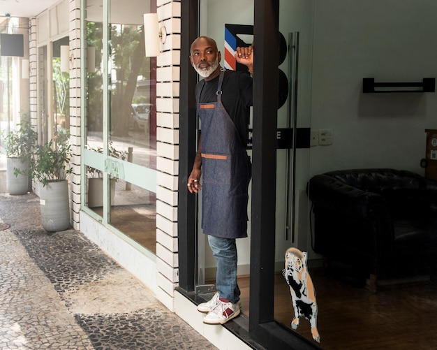 Free photo latino hair salon owner preparing for clients