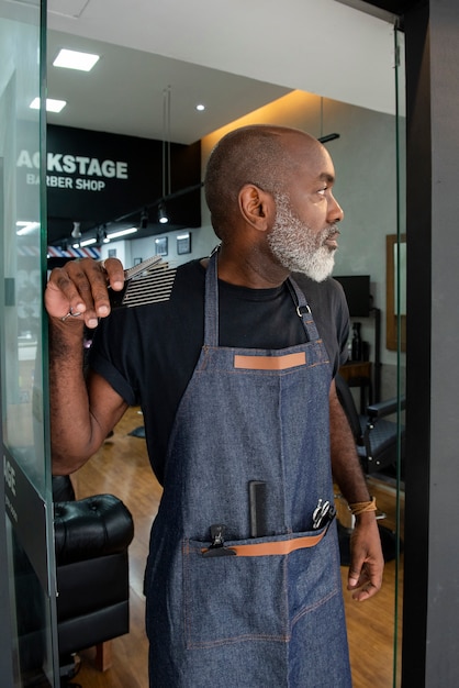 Latino hair salon owner preparing for clients