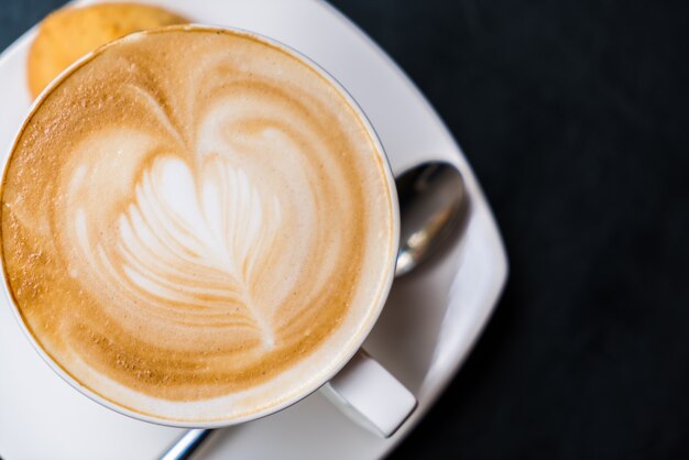 Latte Coffee art on the table .