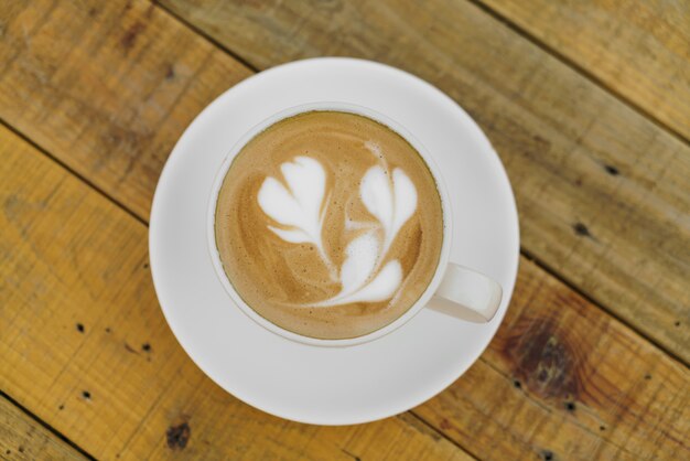 Latte Coffee art on the wooden table