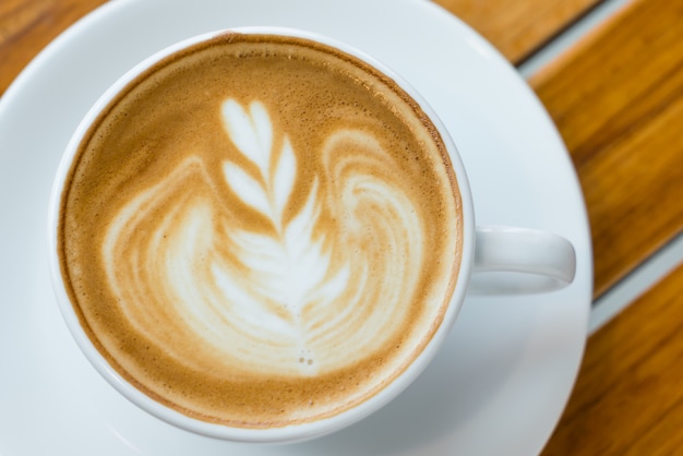 Latte Coffee art on the wooden table