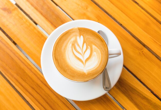 Latte Coffee art on the wooden table