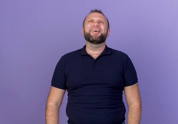 Laughing adult slavic man looking up isolated