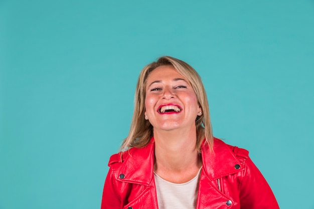 Laughing aged woman in red wear