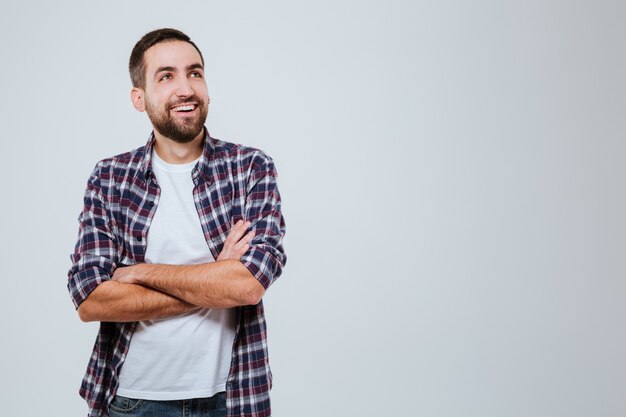 Laughing Bearded man in shirt with crossed arms