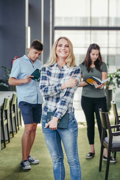 Laughing college girl in library