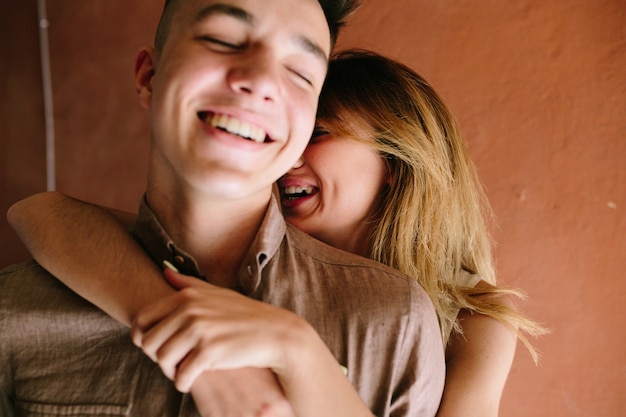 Laughing couple in street