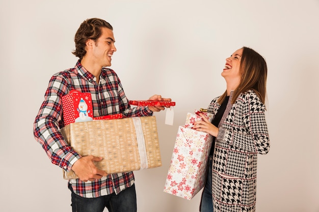 Free photo laughing couple with presents