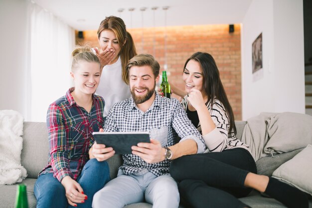 Laughing Friends watching Tablet