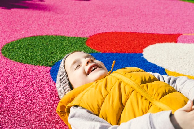 Laughing girl on rubber ground