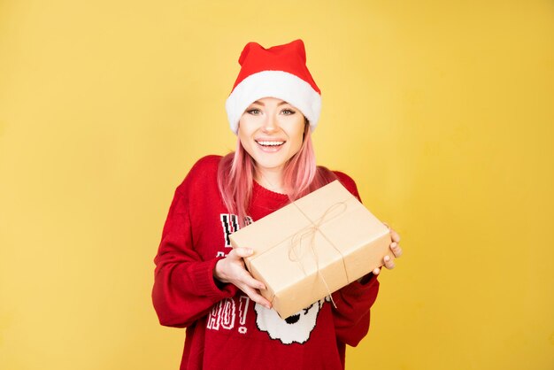 Laughing girl with gifts in hands