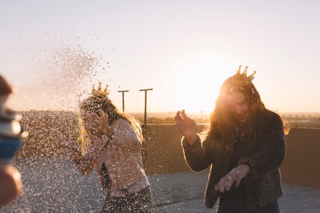 Laughing girls under foam