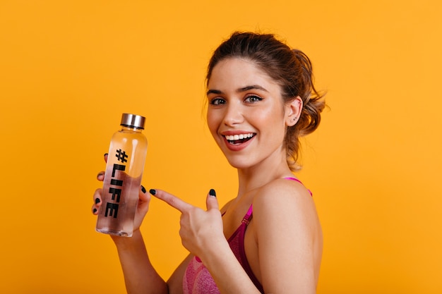 Laughing good-looking woman posing after training