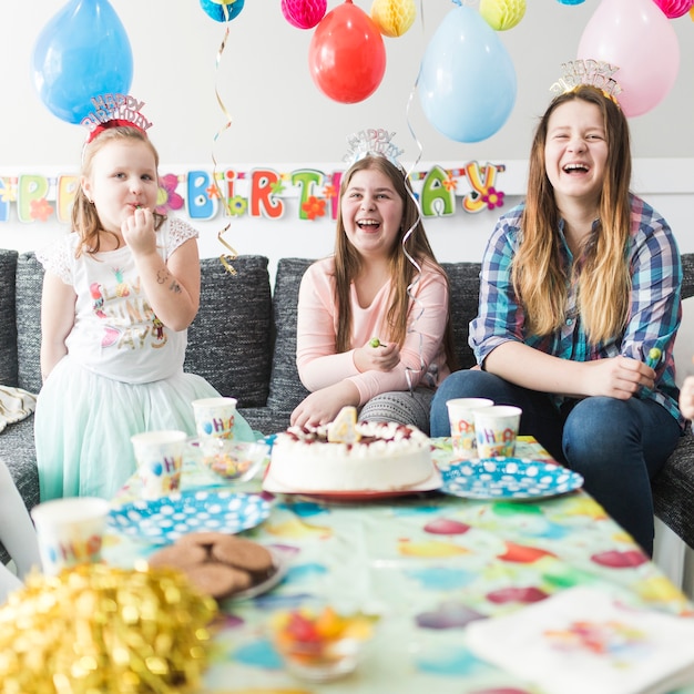 Laughing guests on birthday party