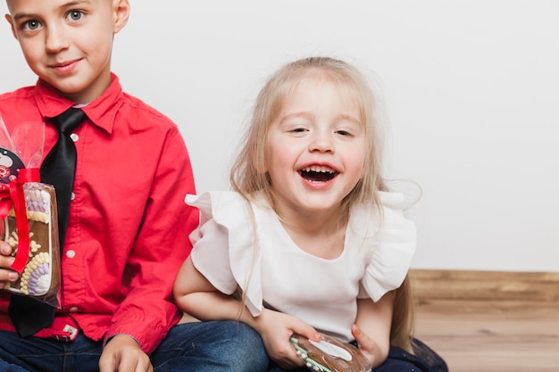 Laughing kids with present box