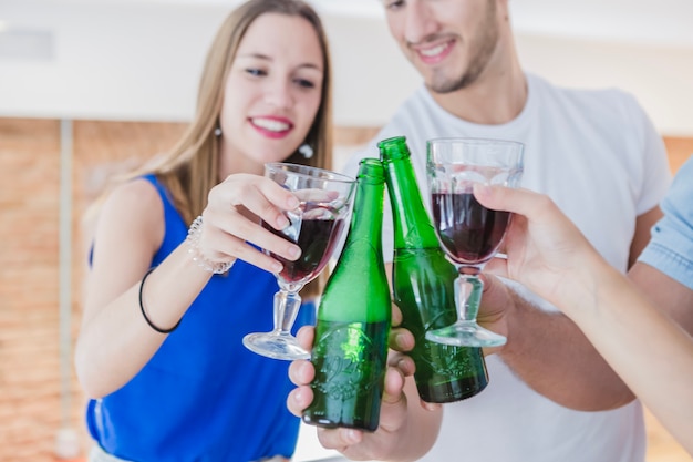 Free photo laughing people toasting at party