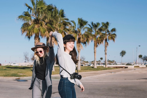 Laughing playful girls on street