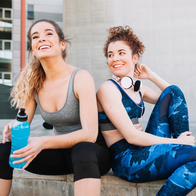 Free photo laughing sportive women outside