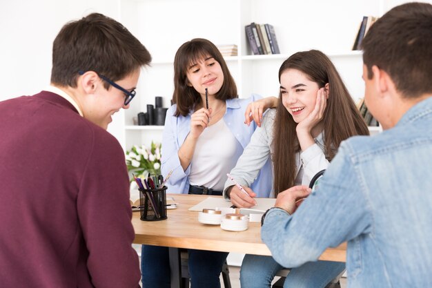 Laughing students in library