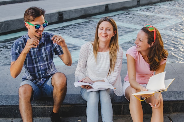 Laughing students preparing for exam