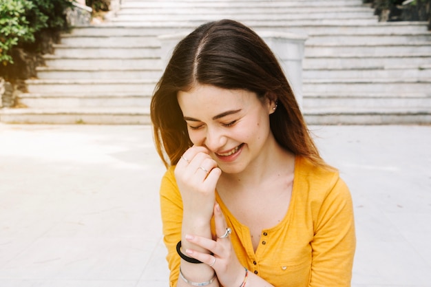 Free photo laughing woman in front of stairs