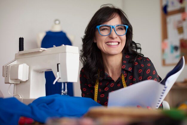 Laughing woman at her work