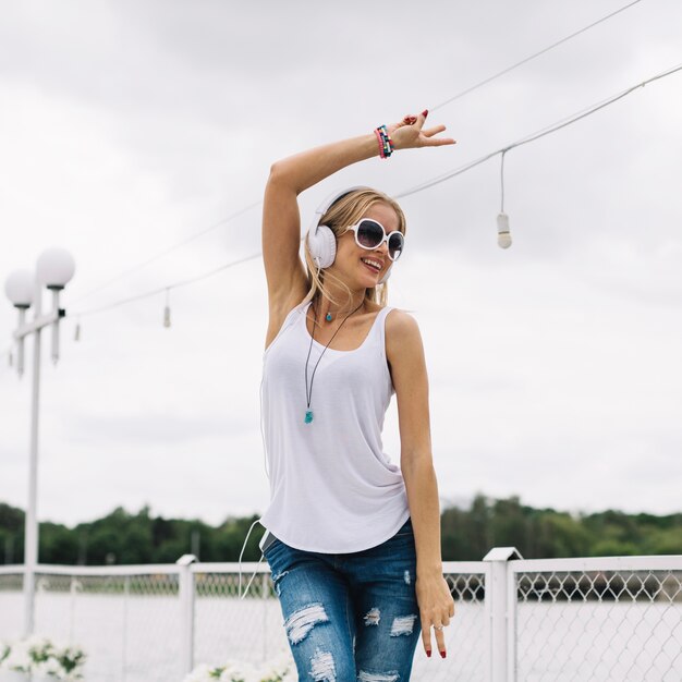 Laughing woman showing peace gesture