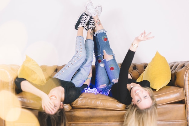 Free photo laughing women on couch