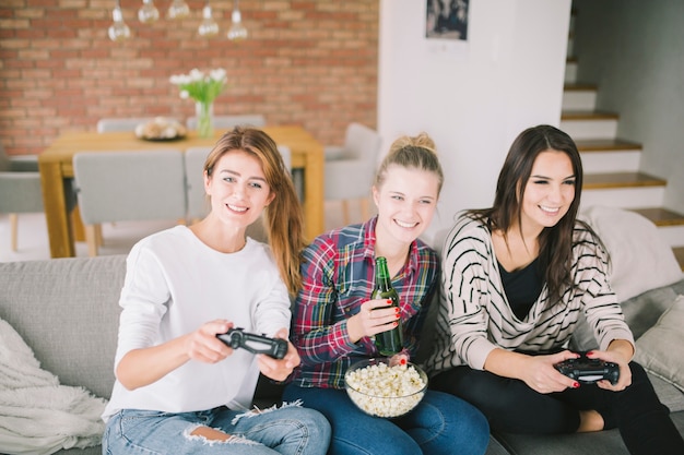 Free photo laughing women having fun with videogame