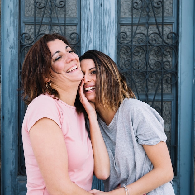 Laughing women near door