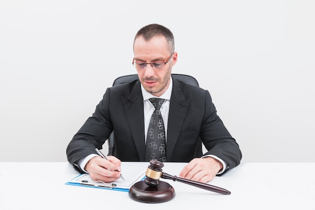 Free photo lawyer filling document