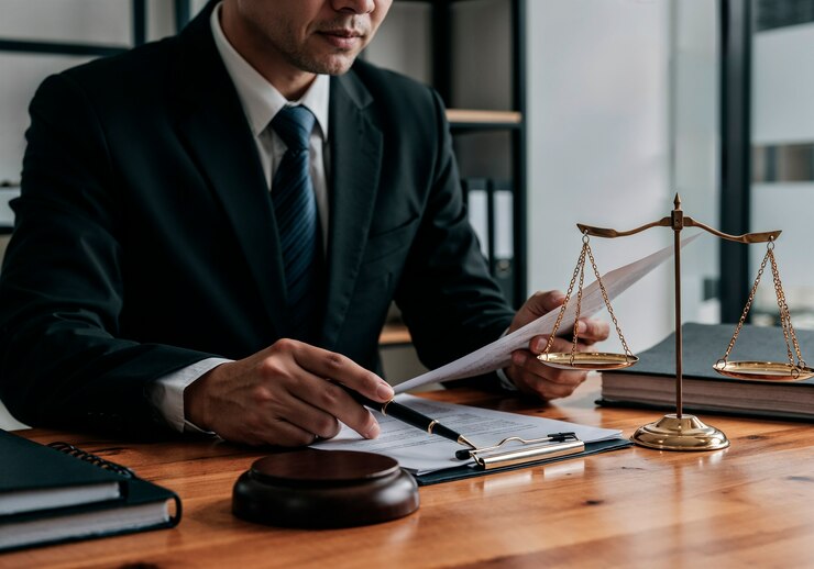 Lawyer working on a document with scales of justice
