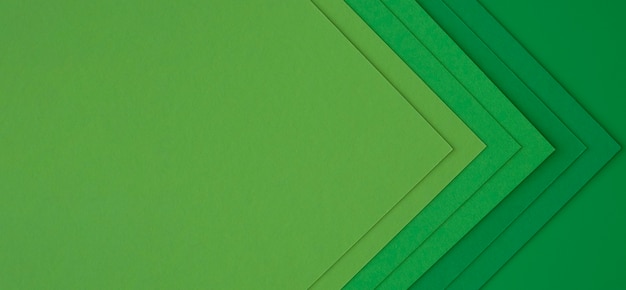 Free photo layers of green papers creating abstract arrows
