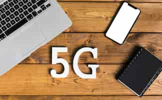 Free photo layout of 5g and gadgets on desk